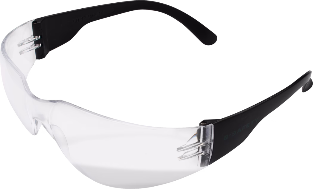 Une paire de lunettes de sécurité conçues pour protéger les yeux. Les verres sont clairs et en matériau durable, tandis que les branches sont noires et offrent un confort optimal. Ces lunettes conviennent à divers environnements industriels et ateliers pour se protéger des débris et autres dangers potentiels.